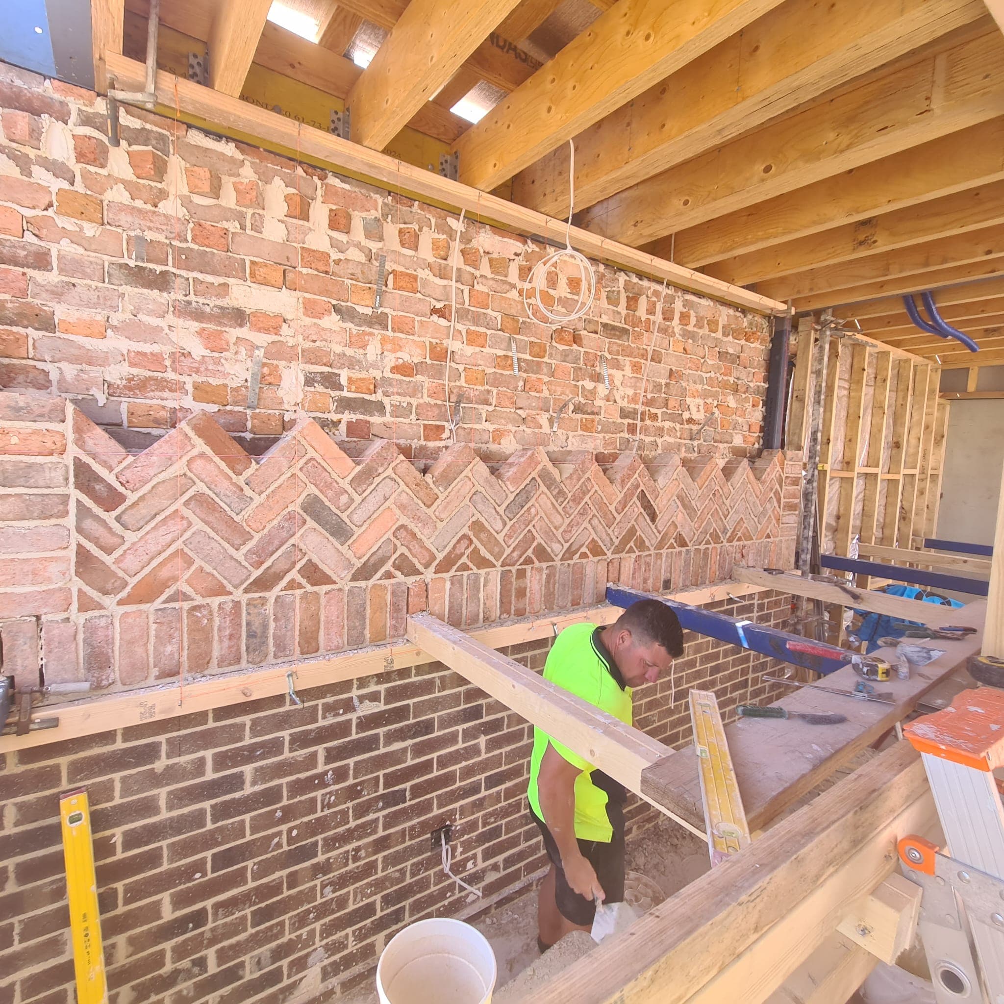 Herringbone brick feature wall under construction by Goodwin Bricklaying