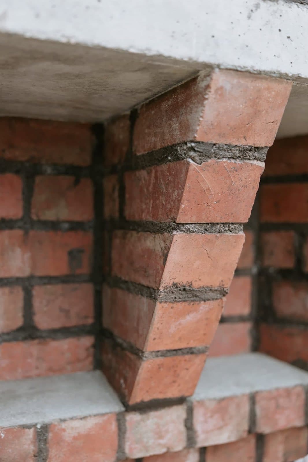 Corner corbel detail beneath the capping of the rebuilt Old Licorice Factory chimney crown, Brunswick