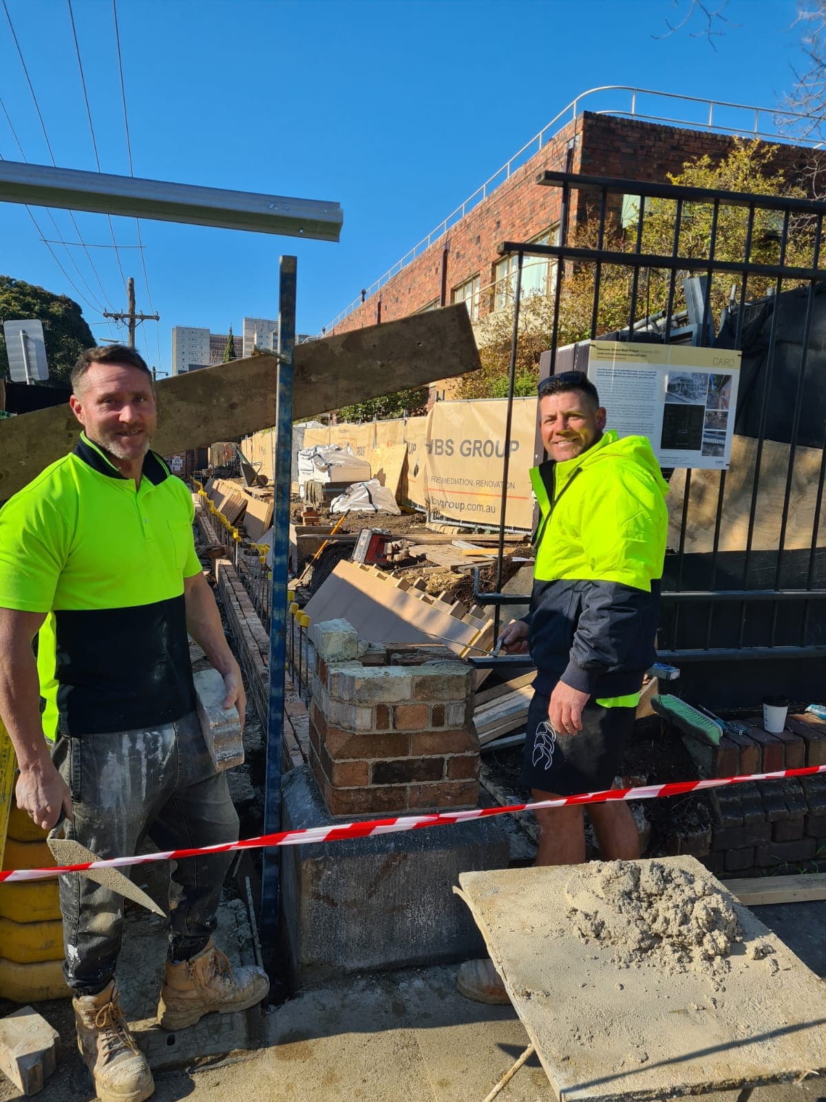 David Goodwin and a team member on the Hanover Street wall project site, opposite the Royal Exhibition Building