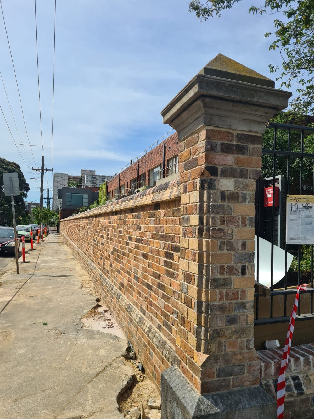 Restored heritage garden wall in Fitzroy rebuilt by Goodwin Bricklaying using reclaimed brick