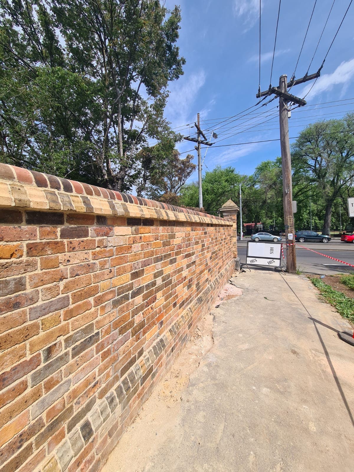 A long view of the completed Cairo flats heritage boundary wall after eight months of restoration, Fitzroy