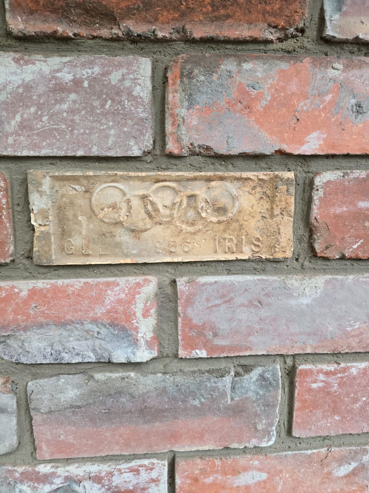 Reclaimed Glen Iris frog-marked brick laid into a restored heritage wall by Goodwin Bricklaying