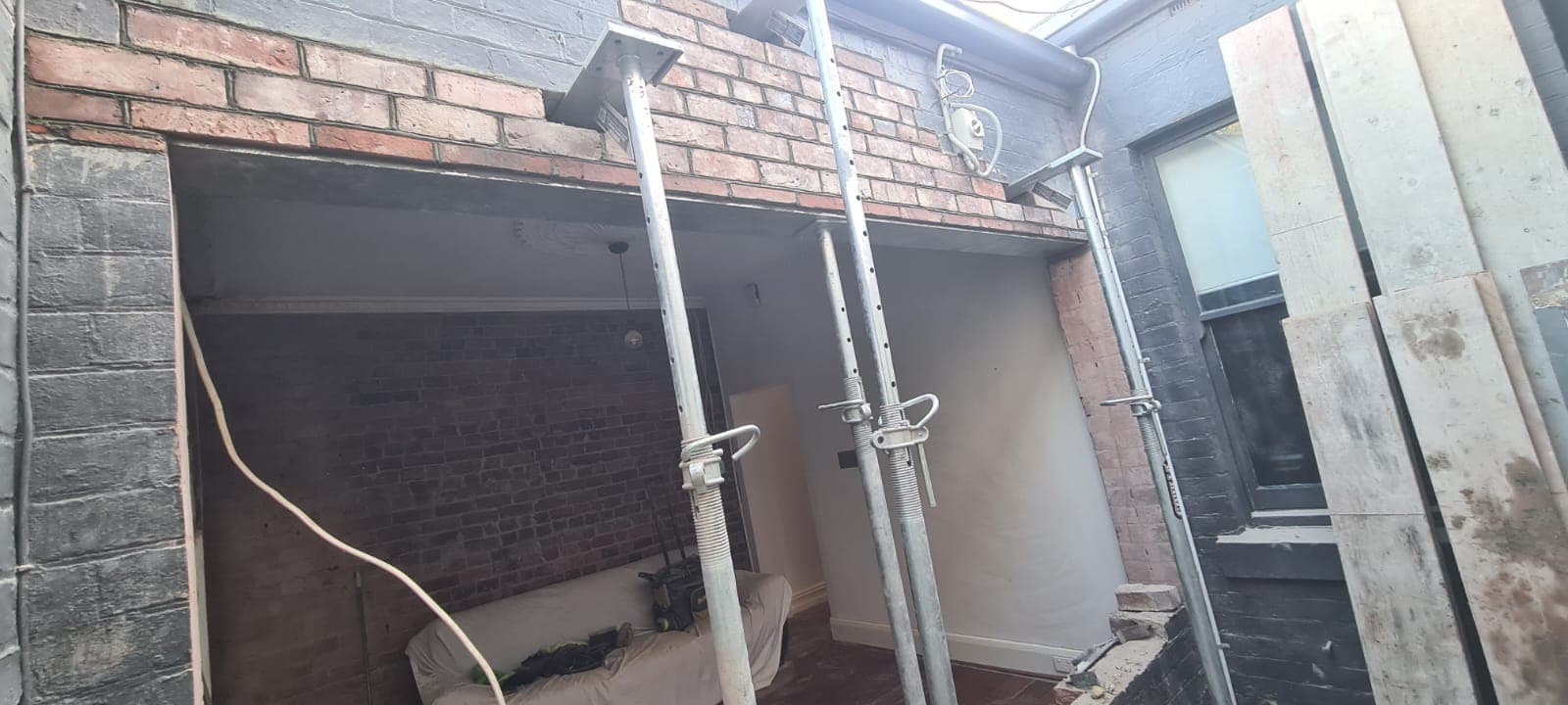 Structural opening propped and rebuilt in original brickwork during a heritage renovation by Goodwin Bricklaying