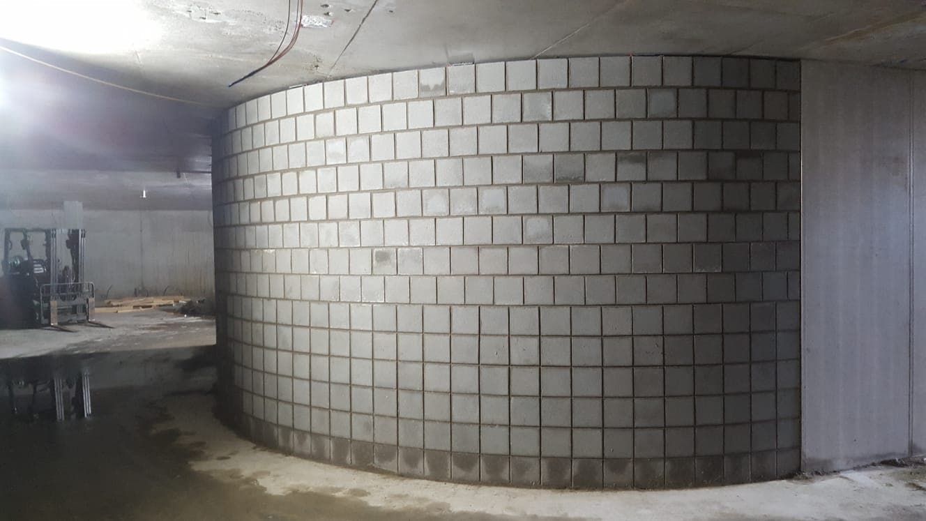 Curved stack-bond blockwork in an underground car park by Goodwin Bricklaying