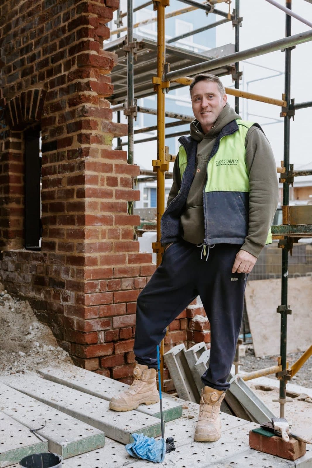 David Goodwin standing beside the base of the heritage brick chimney at the Old Licorice Factory, Brunswick