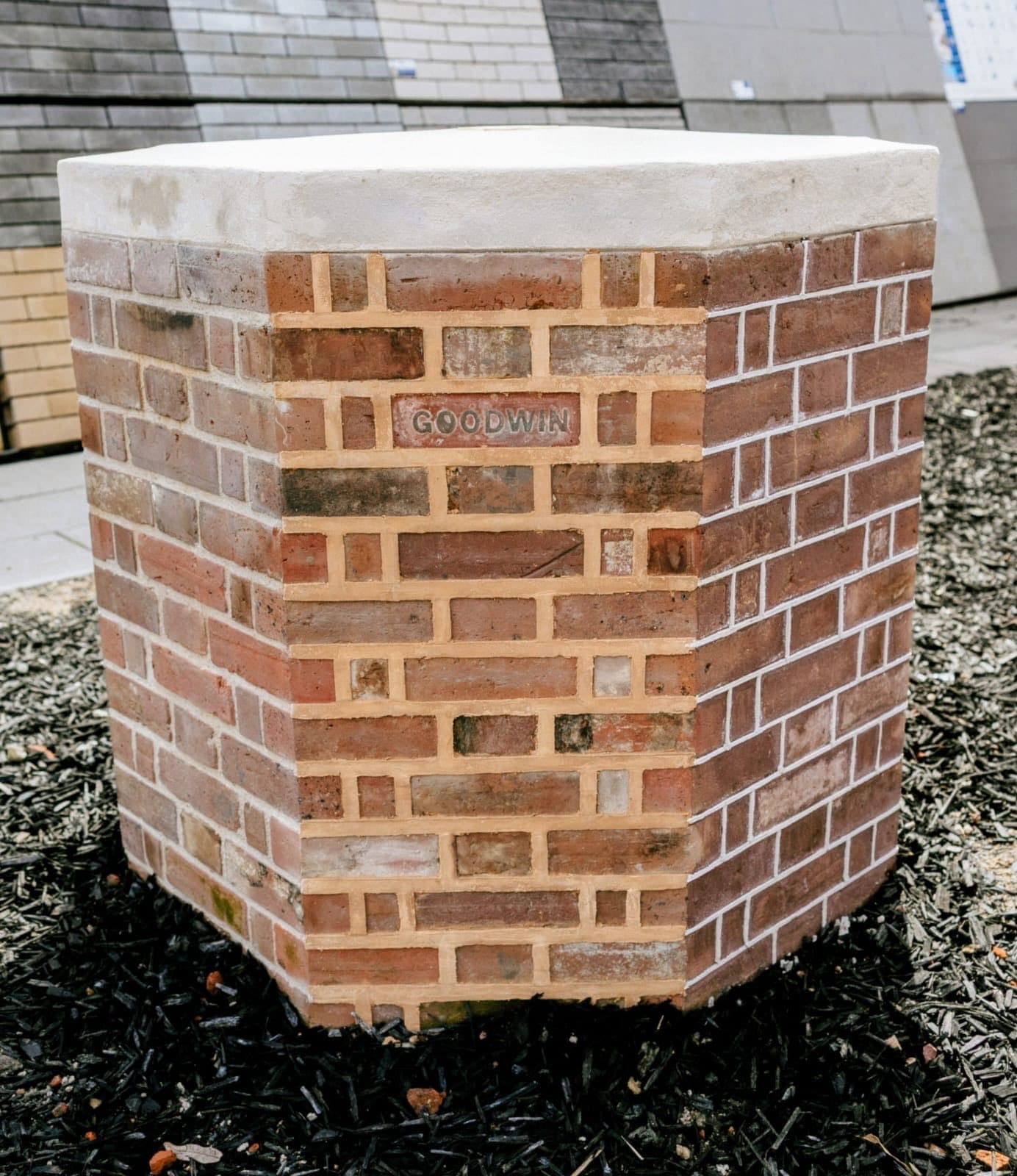 Sample brick pier finished in ribbon pointing, with a Goodwin stamped brick set into the face